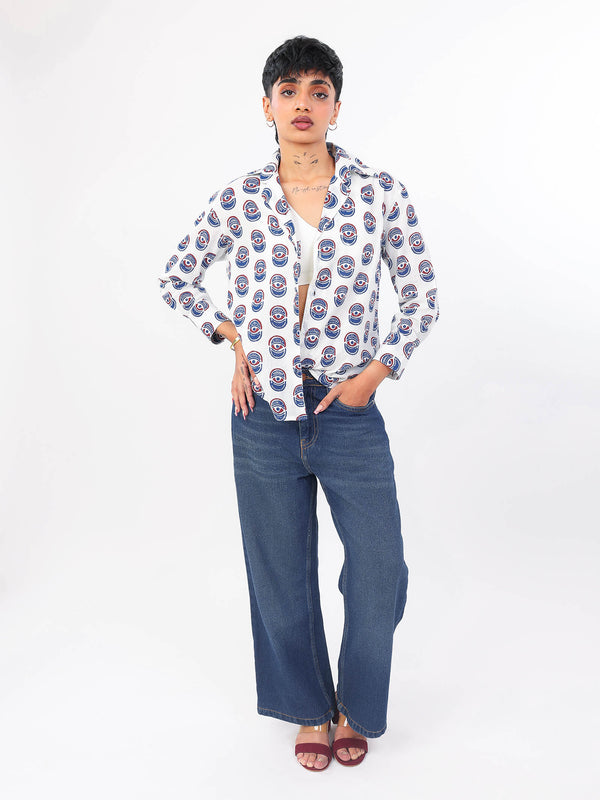 Women wearing a evil eye pattern shirt and jeans on a white background