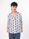 Women wearing a evil eye pattern shirt with a white background