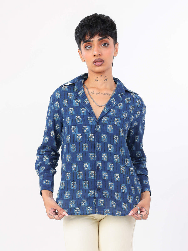 Women wearing a indigo patterned shirt on a white background
