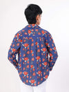 Women wearing a blue floral patterned shirt on a white background