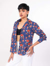 Woman wearing a blue floral patterned shirt on a white background
