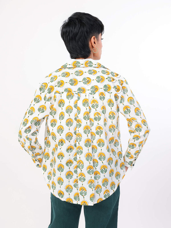 Womanwearing a Sun & Leaf shirt on a white background