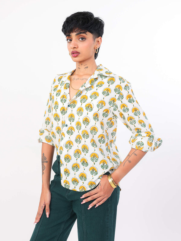 Woman wearing a Sun & Leaf shirt on a white background