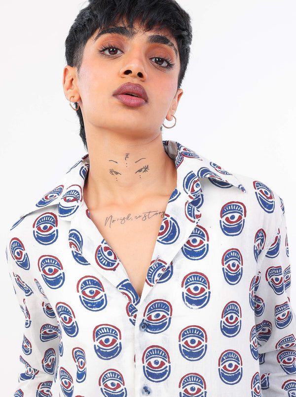 Women wearing a white shirt with evil eye pattern