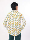 Womanwearing a Sun & Leaf shirt on a white background